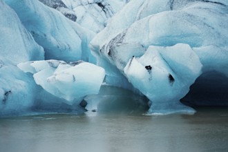 Detailed close-up of blue icebergs showcasing cracks and textures, iceberg, glacier, snow, ice