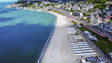 Aerial view on Le Havre Beach with white sand and cityscape: summer begin in normandy! Small white