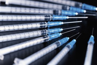 Medical Syringes Needle on Black Background, Close up Syringe