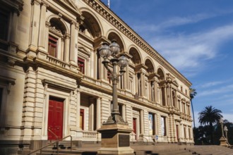 MELBOURNE, AUSTRALIA - JANUARY 8 2025: Old Treasury Building on a hot summer's afternoon in