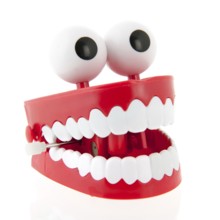 Funny denture with eyes isolated over white background