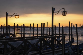 Morning atmosphere, gondola jetty, dawn over the lagoon, Venice, Veneto, Italy