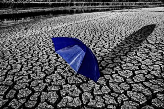 Dry River Bed cracked soil umbrella Canada Drought