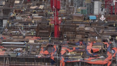 Workers busy with construction. Building a house in Kuala Lumpur, Malaysia