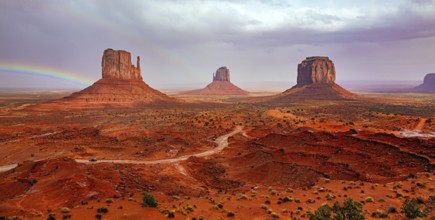 USA. Navajo Indian Reservations. The famous rock Mitten and the bright rainbow. Monument Valley is