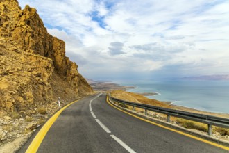 Israel. The highway runs along the coast of the Dead Sea. Jordan on the opposite coast of the sea