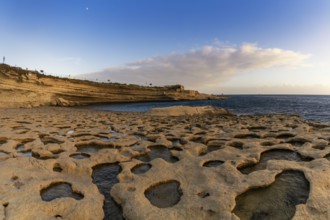 A view of the tidal pools and cliffs at Il-Hofra z-Zghira Bay in Malta