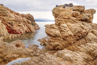Rugged rocky coast of the Plage de Stagnoli on the Mediterranean Sea, Gulf of Sagone, west coast of