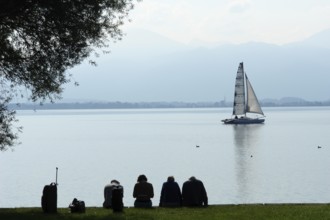 Small group of travellers waiting for the ship to arrive