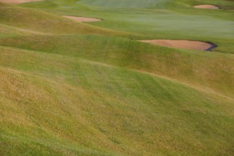 Summer golf course with different bunkers