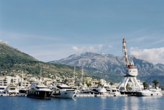 Crane on a platform near the marina in Porto. Montenegro.