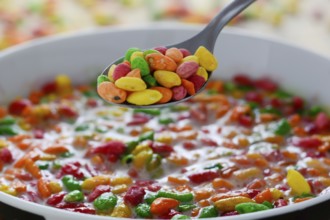 Prepared breakfast with colorful puffed rice with spilled rice in the background