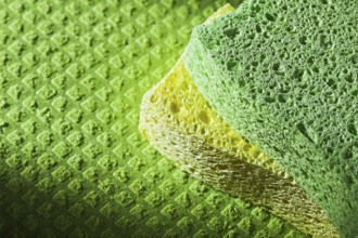 Cleaning kitchen sponges on dishcloth
