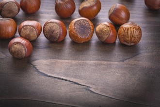 Set of hazelnuts on vintage wooden board food and drink concept