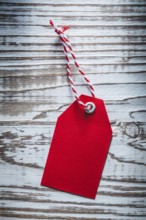 Red pricetag on vintage wooden board shopping concept