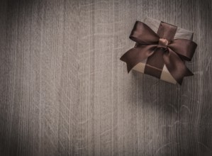 Vintage gift box on wooden board holiday concept