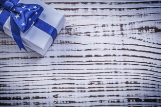 Packed present on vintage wooden board greeting card holidays concept