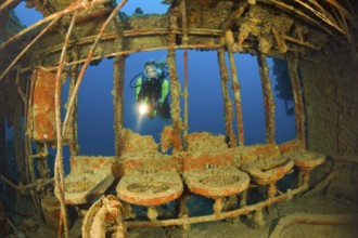 Divers in the washroom of the destroyer USS Lamson, Marshall Islands, Bikini Atoll, Micronesia,