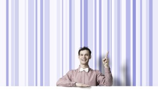 Young funny guy in checked shirt with banner pointing with finger up
