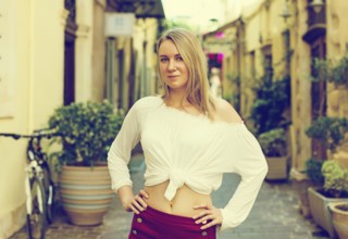 Pretty woman posing on the street. Place for text