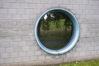 Round window in a concrete wall