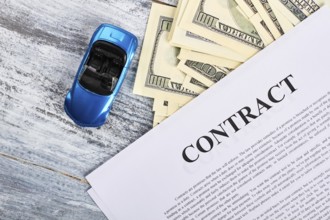 Car documents and currency. Conclusion of purchase agreement
