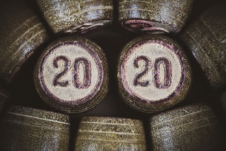 Vintage wooden lotto kegs two numbers 20 and 20 as symbol of 2020 year. Close-up top view of 2020