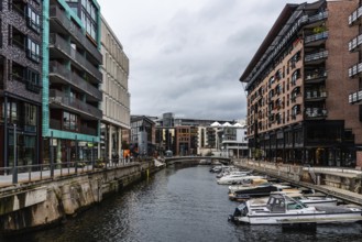 Oslo, Norway, August 11, 2019: Canal with boats in Tjuvholmen quarter, a new modern urban renewal