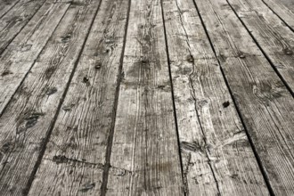 Weathered gray wooden floorboards as background photo