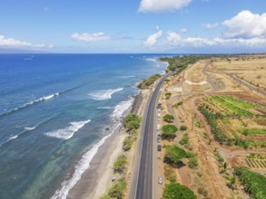 Aerial view of beach and ocean with waves in the island of Maui, Hawaii. Launiupoko State Beach