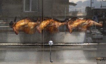 Chickens are grilled at a street cafe, Gyumri, Armenia