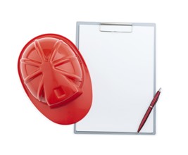 Red Construction Helmet And Ballpoint Pen On Clipboard Isolated