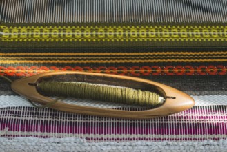 Vintage loom and yarn. Knitting carpet