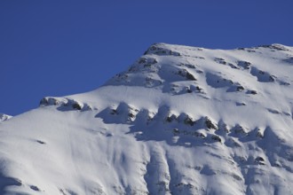 Mittaghorn mountain in winter, Elm