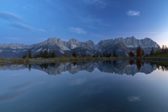Wilder Kaiser reflected in the Astbergsee in the early morning, Going, Tyrol, Austria