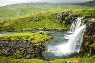 Overcast cold summer day in Iceland. Concept of extreme and exotic tourism. At the foot of the