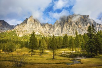 The concept of ecological and extreme tourism. The dizzying Dolomites. Sharp rocks surround the