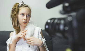 Teenage girl making video blog at home. Vlog concept