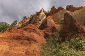 Red ocher cliff in the Luberon in Provence. Roussilon, Vaucluse, France