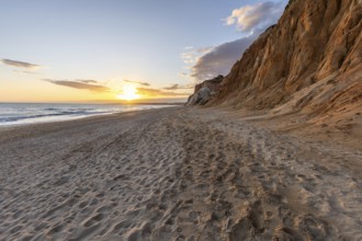 The golden sandy beach of Praia da Falésia with its characteristic orange-coloured cliffs,