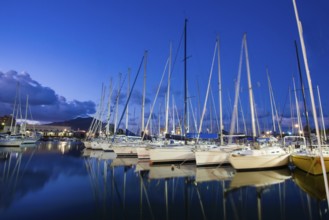 Idyllic view of sailing boats in the harbor of Palermo. Blue hour and Magic reflection in watrer.