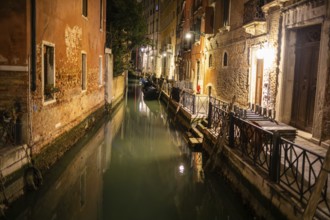 Boats in a canal, night shot, Venice, UNESCO World Heritage Site, Veneto, Italy