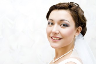 Young charming bride looks into camera, closeup