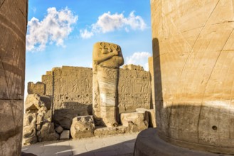 Headless statue among the ruins in Karnak Temple, Luxor