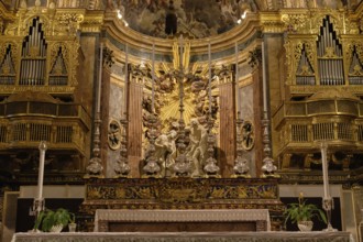 The ornate Baroque main altar and organ of St. John Co-Cathedral, Valletta, Malta