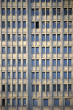 The façade of a modern office building with many windows