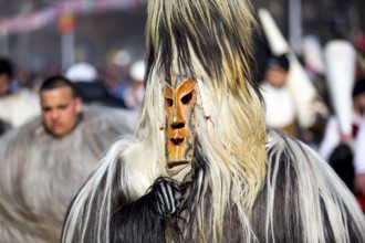 Participants take part in the International Festival of Masquerade Games Surva. The festival