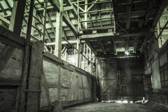 Urban exploring in an old abandoned farm house, a lost place with dirty furniture and dusty