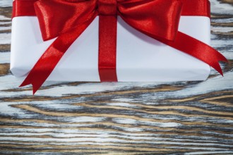 Red gift box on wooden background horizontal view