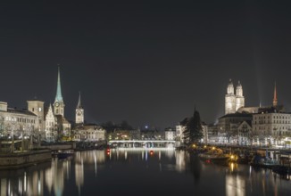 Limmat river with view of churchs in Zurich in evening, Switzerland